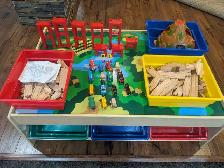 Wooden train set and table with 6 plastic storage bins
