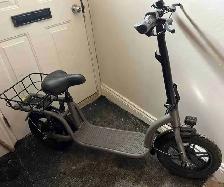 Gotrax scooter with seat and basket
