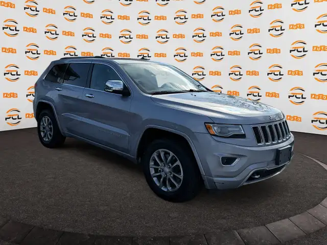 2014 Jeep Grand Cherokee Low Km AWD Hseat Bcam Nav 1yr warranty