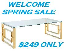 EROS COFFEE TABLE IN POLISHED GOLD AND THICK GLASS..