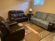Dark brown leather recliner couch and love & chair seat. Used In