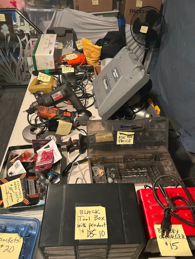 Table full of power tools for sale, cordless drills, etc.