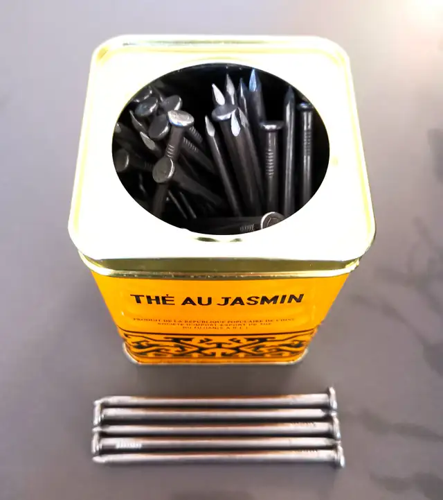 A box of brand new 4-inch nails (over 50pcs)