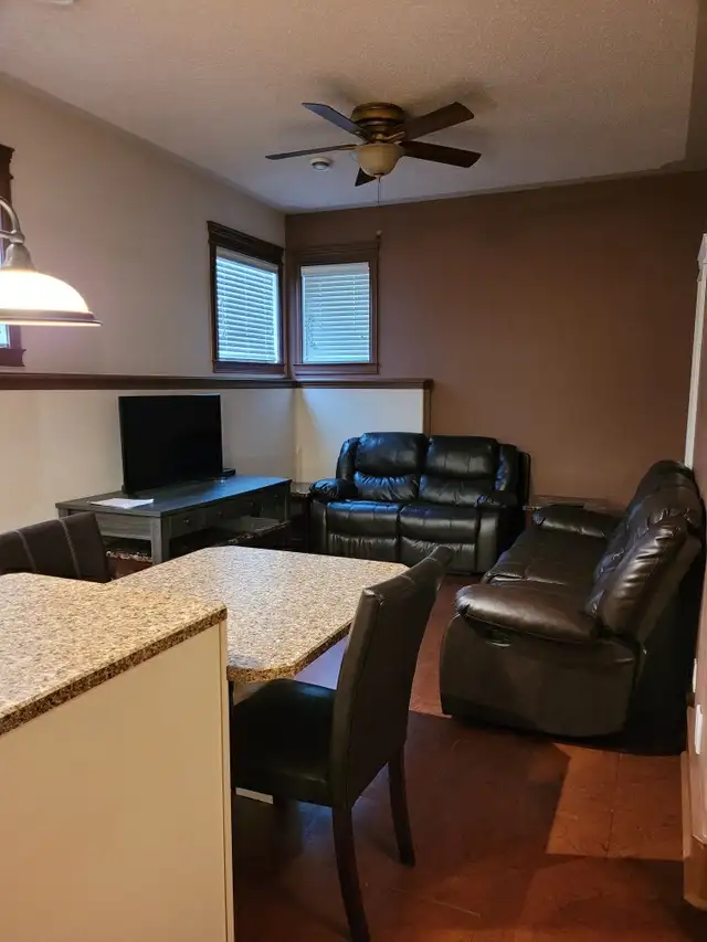 Basement suite & attached heated garage Ready to move-in - Photo 2