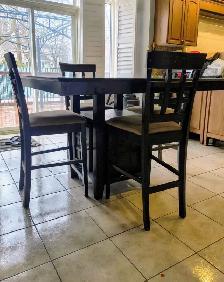Free delivery used Dark Wood Counter Height Table with 4 Chairs