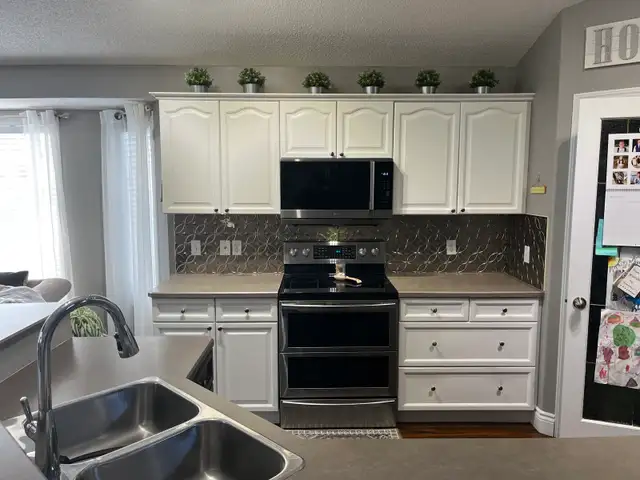 Kitchen cabinets and island - Photo 5