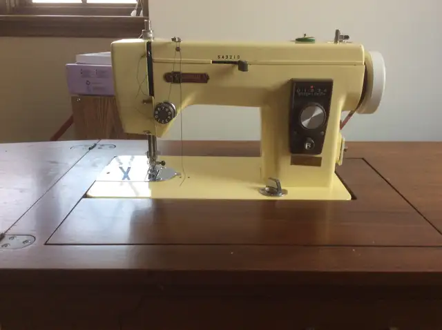 sewing machine with cabinet