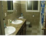 Room for rent in quiet triplex. Close to bus route, plaza