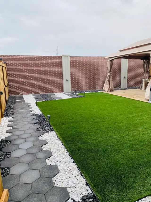 sod fence deck rocks junk removal landscaping - Photo 6