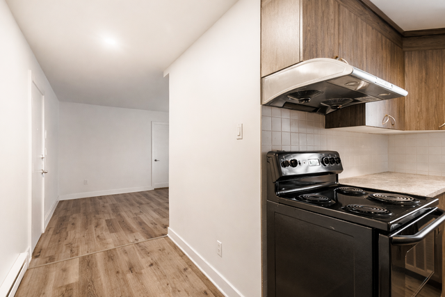 3½ Tranquille Rénové | WiFi, rangement et surveillance 24h - Photo 3