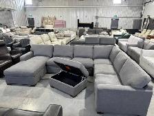 Grey fabric sectional with chaise and storage ottoman
