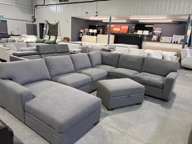 Grey fabric sectional with chaise and storage ottoman - Photo 3