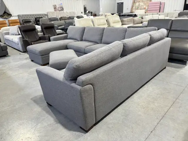 Grey fabric sectional with chaise and storage ottoman - Photo 4