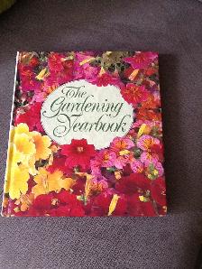 THE GARDENING YEARBOOK and one pair of gardening gloves