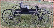A Single Horse Drawn Buggy.
