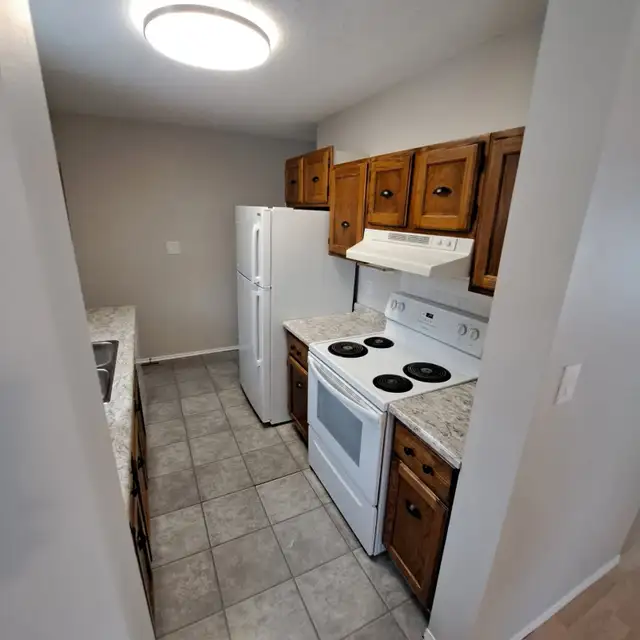 A total Charmer! 1200 sq ft, Fenced yard, 2 parking stalls. - Photo 2