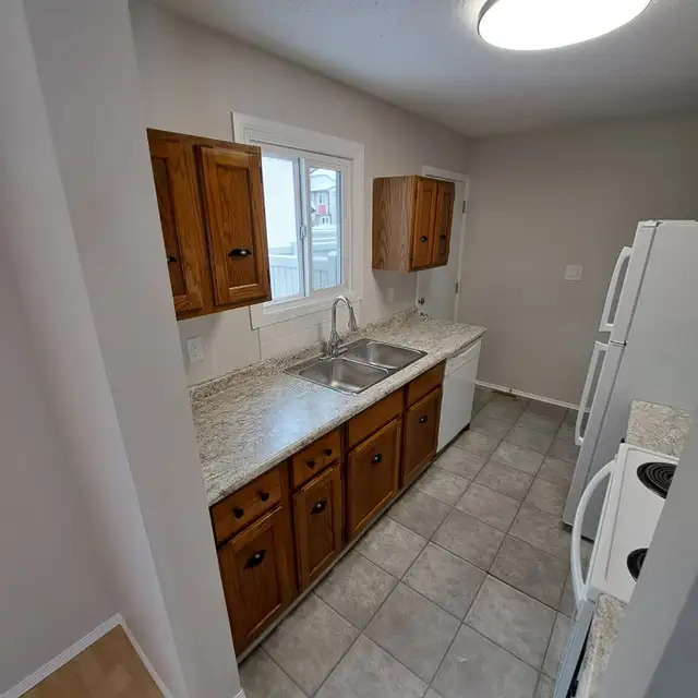 A total Charmer! 1200 sq ft, Fenced yard, 2 parking stalls. - Photo 3