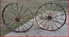 Two Vintage Antique Steel Wheels.  Four feet tall.