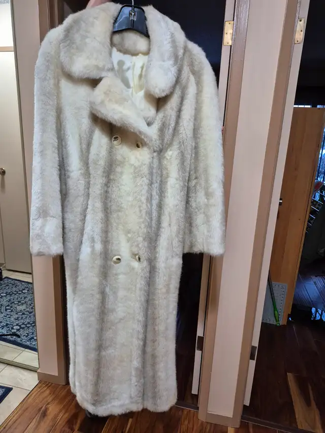 Fur coat, size 10-12, lined. $ 100