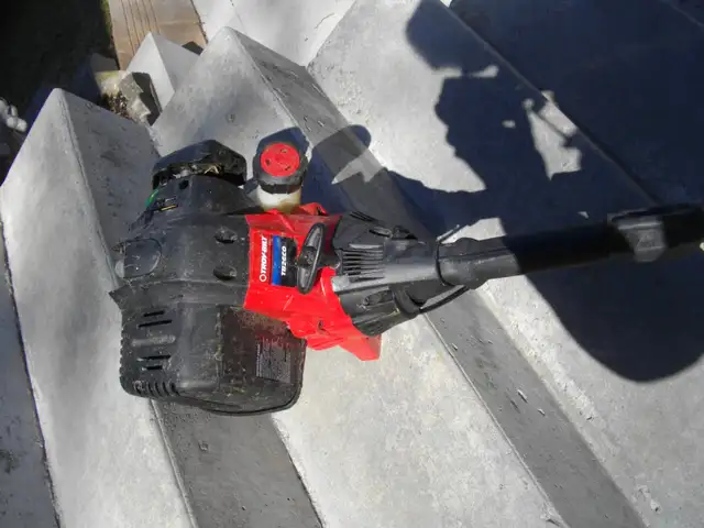 GAS POWERED WEED WACKER FOUND IN STORAGE SHED