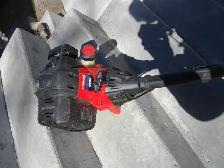 GAS POWERED WEED WACKER FOUND IN STORAGE SHED