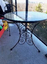 Cast Iron Table and 2 Chairs with a Plant Stand.