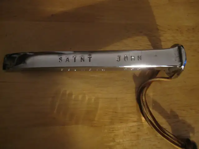 CHROME PLATED SAINT JOHN RAILROAD SPIKE BOTTLE OPENER MINT COND