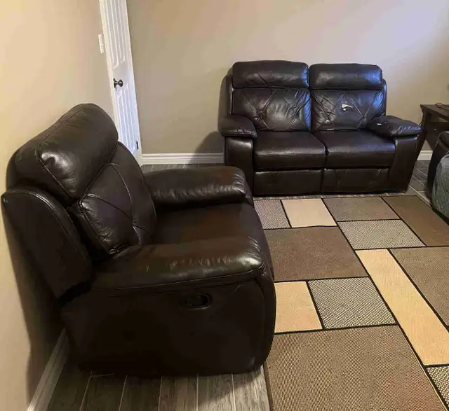 Dark brown leather recliner love seat & chair seat. Used In