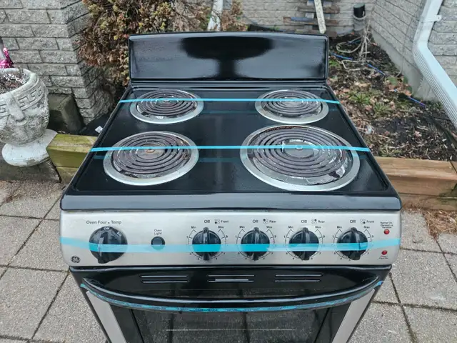 Like NEW GE 24' Stainless Steel Slide-in Electric Coil Top Stove - Photo 2