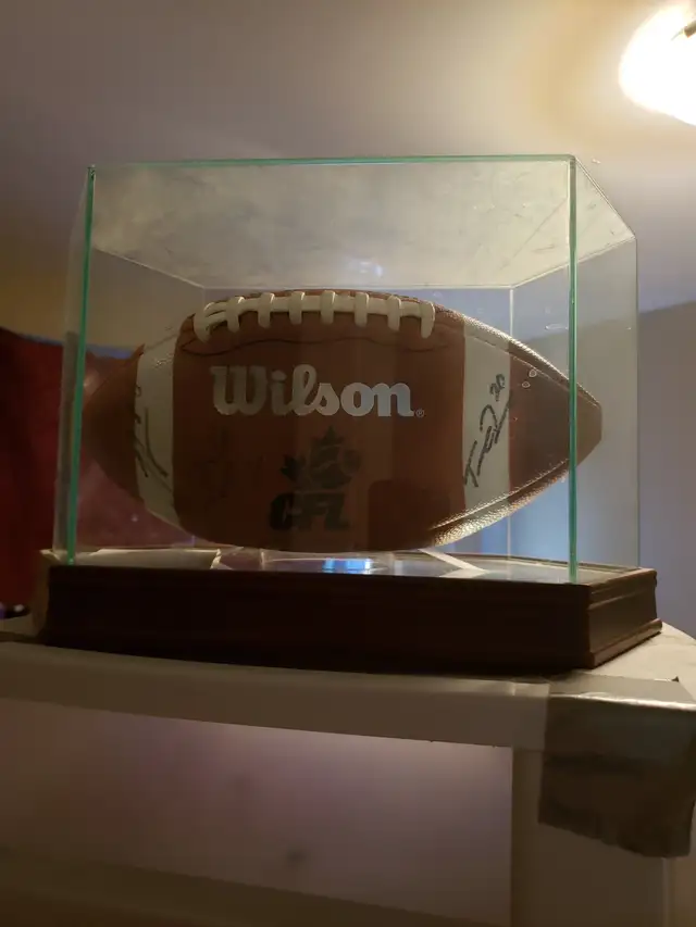 Autographed 2013 grey cup champs roughriders football