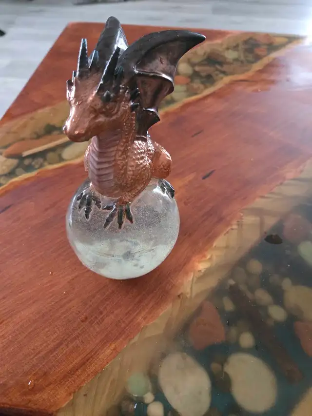 assorted apoxy dragon an skull sculptures