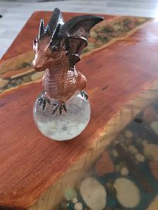 assorted apoxy dragon an skull sculptures