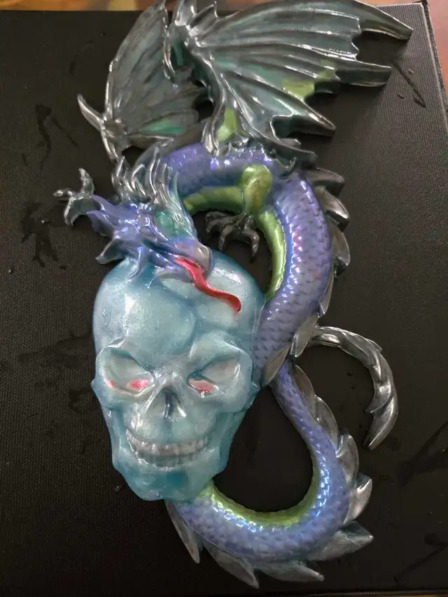 assorted apoxy dragon an skull sculptures - Photo 4