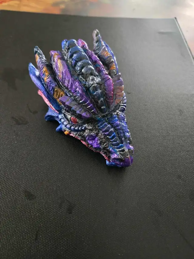 assorted apoxy dragon an skull sculptures - Photo 5