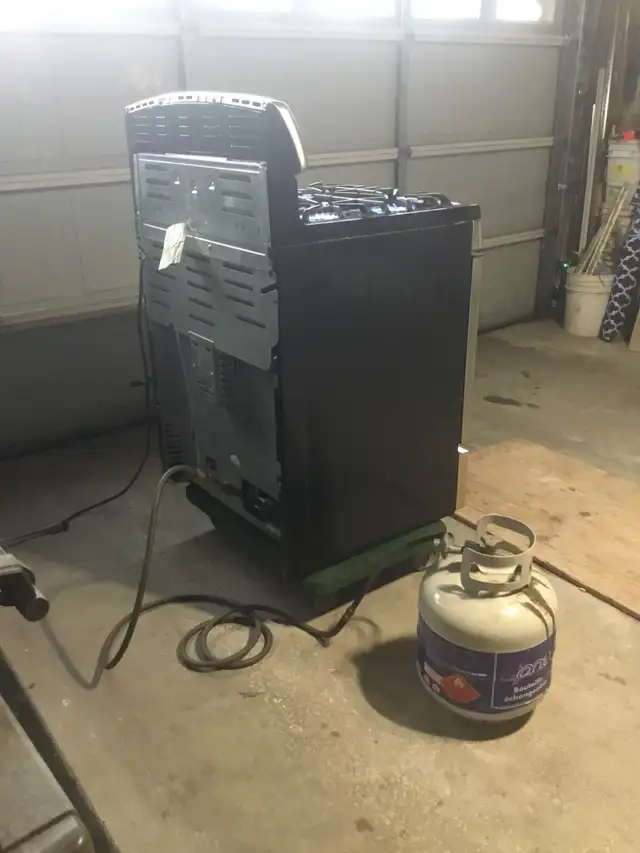 GE Stainless Steel 30 INCH PROPANE GAS STOVE $525 - Photo 9