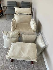 Cream fabric reclining arm chair $250.  Ottoman, 4 pillows