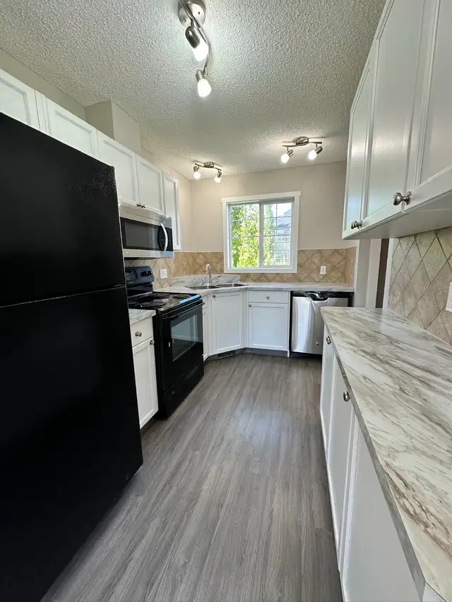 AIRDRIE: Rent to Own 3 Bedroom Townhome in Sagewood - Photo 2