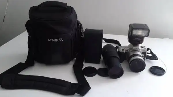 MINOLTA FILM CAMERA WITH ZOOM LENS AND FLASH LIGHT (New)