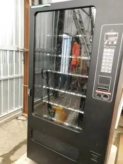 LARGE VENDING MACHINE IN GOOD CONDITION $1,500.00
