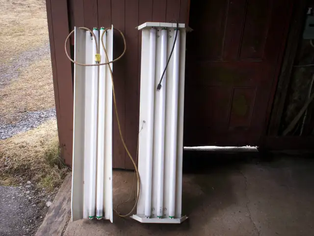 Two - 4' Fluorescent light fixtures