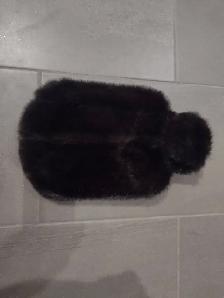 Bouillotte recouvert de vison flambant neuf jamais utiliser.