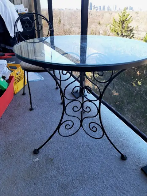 Cast Iron Table and 2 Chairs with a Plant Stand.