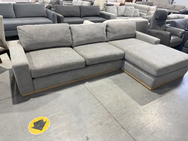 Grey fabric sectional with oversized chaise- demo