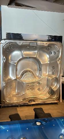 Huge Jacuzzi brand hot tub with lounger