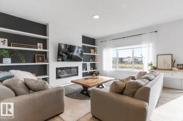 POND BACKING FORMER SHOW HOME IN RIVER'S EDGE 2326sqft - Photo 5