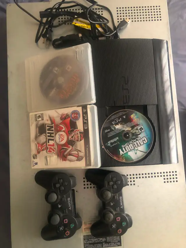 PS3 Super-Slim 500G storage, 2remotes 3games and accessories for
