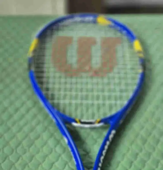 professional Wilson tennis racquet.Hardly used.