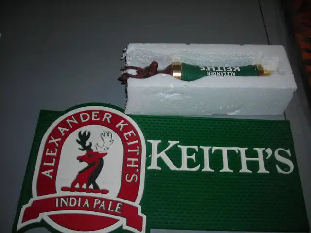 bar matt and beer tap