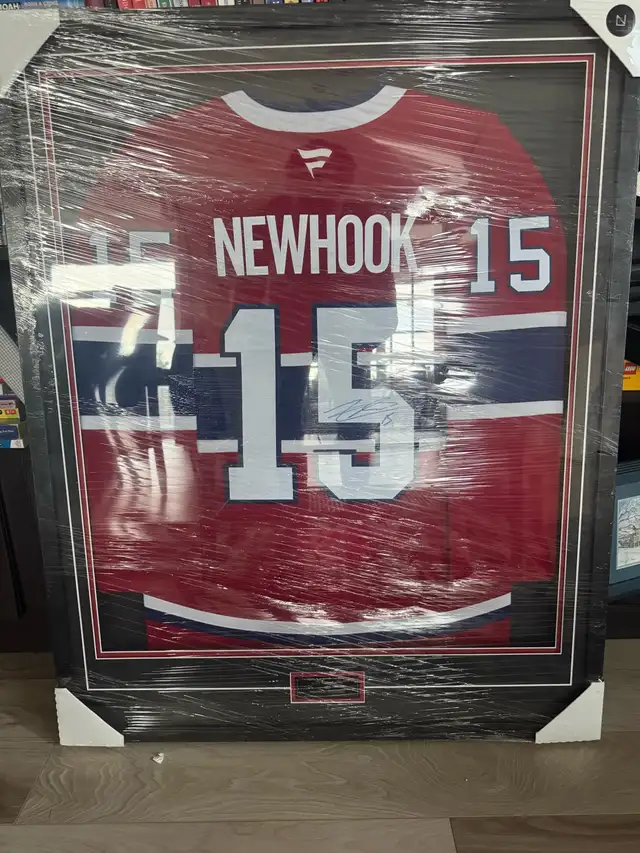 Signed and framed authentic Alex Newhook jersey.