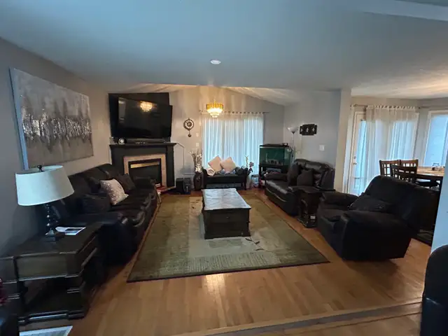 Dark brown leather recliner sofa set with loveseat